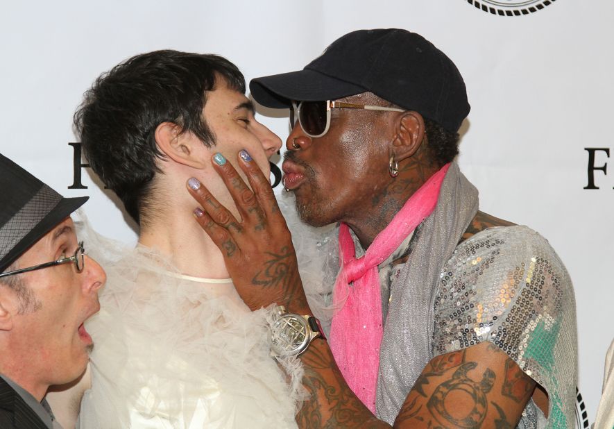 Rodman puckers his lips and holds the face of writer/director Alex Forstenhausler at the "So You Think You Can Roast?" event at the New York Friars Club in 2013.