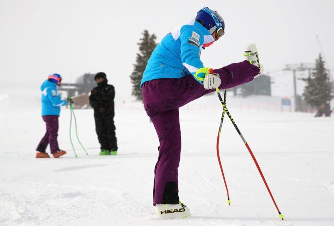 Vonn stretches her troublesome knee as she prepares for downhill training at Copper Mountain, Colorado, in November 2013.