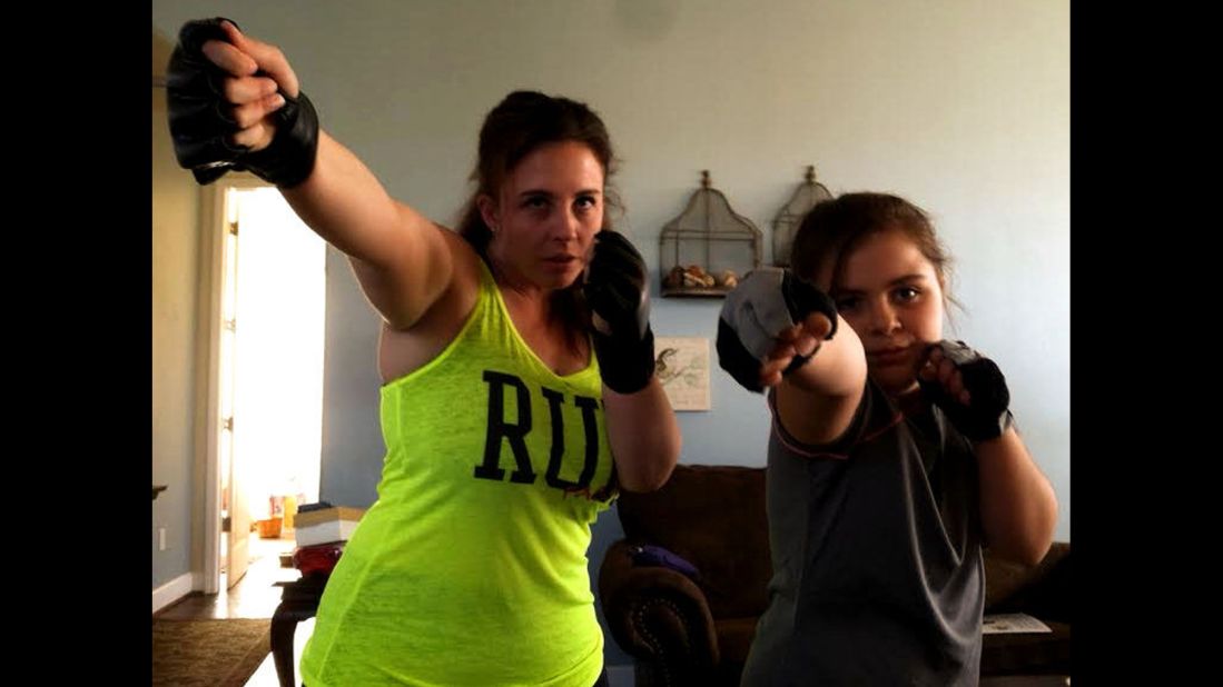 Jenni Conner of Santa Maria, California, and her 9-year-old daughter, Skylar, do a combat fitness program together at home every night. "I don't have to ask, she wants to do it," said Conner, a mom of two. "She has lost weight and built muscle. ... It's all because she watched her mom and chose to follow my lead."