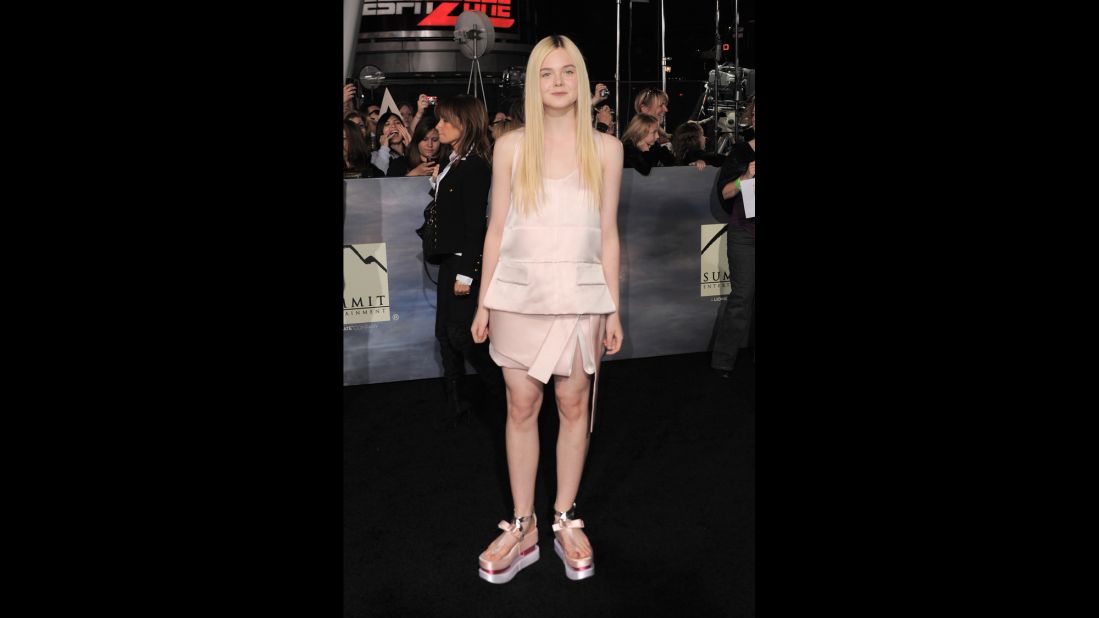 Flatforms, like Elle Fanning's pink satin Prada sandals, will not return to the fashion fray in 2014. Really, have you tried walking in them?