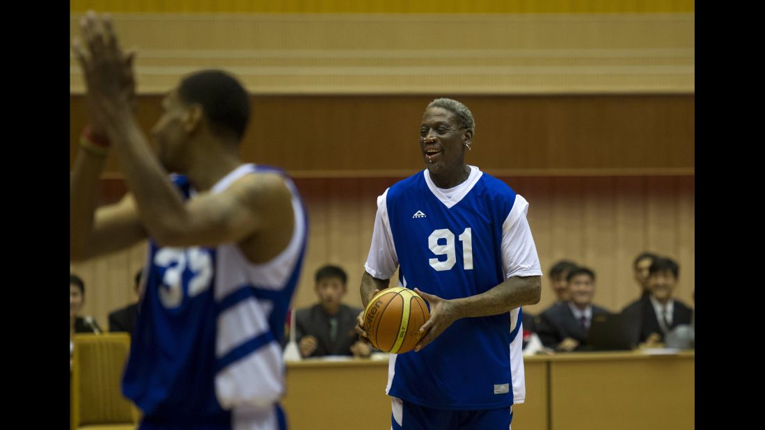 Rodman and Jerry Dupree react to a play during the game.