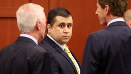 SANFORD, FL - APRIL 30:  George Zimmerman (C), defendant in the killing of Trayvon Martin, stands in Seminole circuit court with his attorney Mark O'Mara (R) for a pre-trial hearing April 30, 2013 in Sanford, Florida. Lawyers on both sides of the Trayvon Martin murder trial are jockeying for position as the trail is expected to start June 10. The defense seeks to add witnesses, but declines to identify them as the prosecution accuses them of grandstanding.  (Photo by Joe Burbank/Pool/Getty Images)
