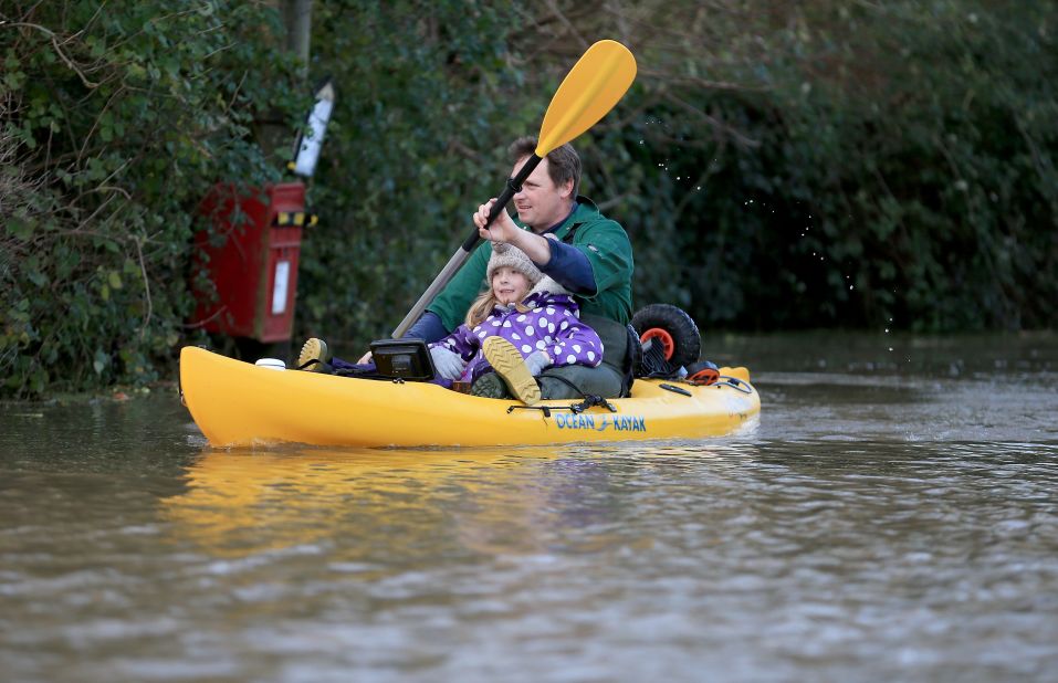 Extreme sports aren't for everyone.  A resident in Somerset, England opts for a serene ride in a canoe to escape the floodwaters.