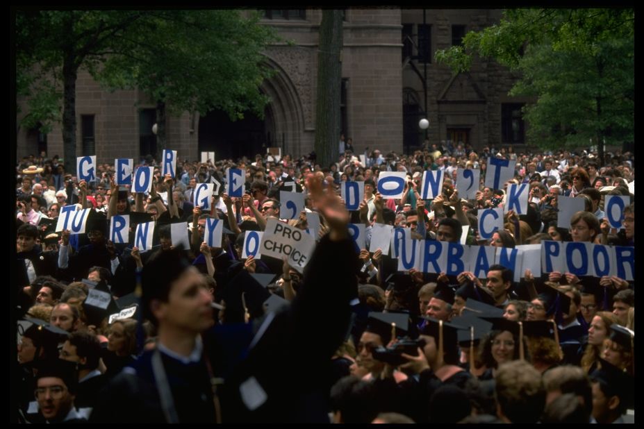 During a 1991 commencement speech given by President George H. W. Bush at Yale University, attendees hold signs that read, "George, don't turn your back on urban poor." Like Carter, Bush was more concerned with other issues during his presidency.