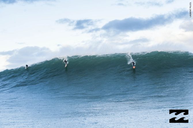 French rider Benjamin Sanchis (center) and American Shane Dorian (right) ride the Belharra waves. Muscle power was required as the pair paddled out to the looming water instead of a jet ski powered takeoff.