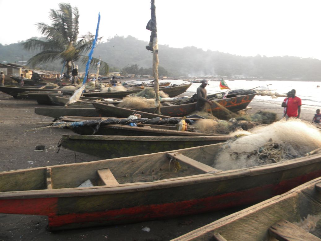 Limbe's black sand beaches are popular with tourists, and are home to sun seekers and busy local fishermen.