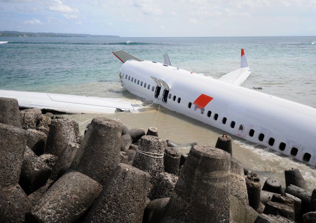 Indonesia's Lion Air received two stars. Here one of the carrier's Boeing 737s lies partially submerged in the water after it crashed while attempting landing at Bali's Denpasar International Airport in April 2013. 