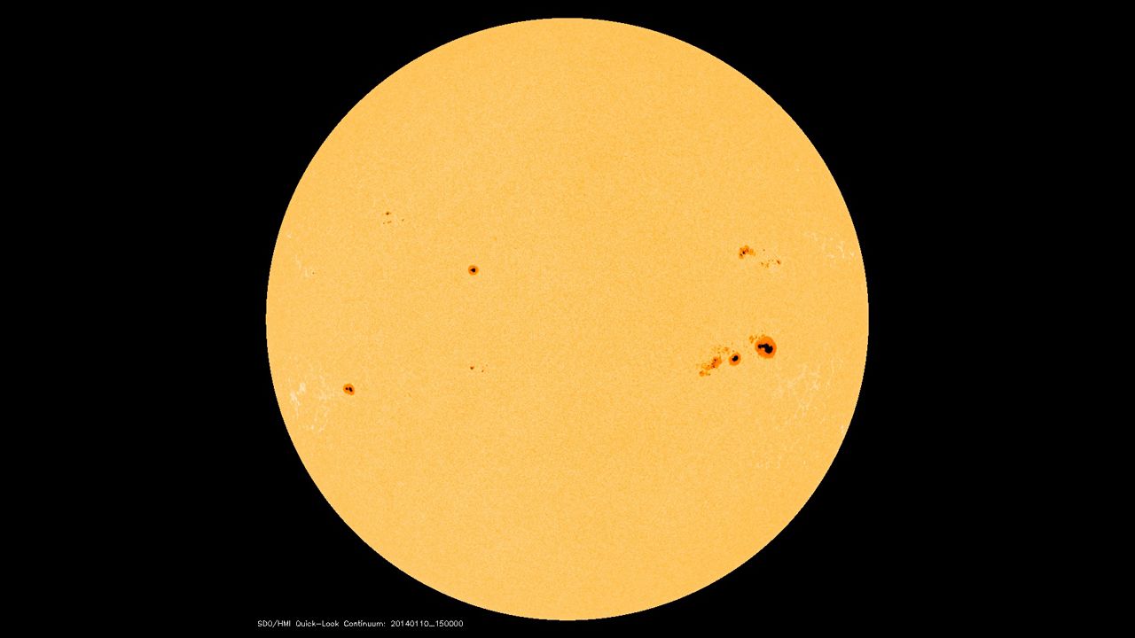 Those spots on our sun appear small, but even a <a href="http://www.nasa.gov/content/goddard/giant-january-sunspots/" target="_blank" target="_blank">moderate-sized spot is about as big as Earth</a>. They occur when strong magnetic fields poke through the sun's surface and let the area cool in comparison to the surrounding area.