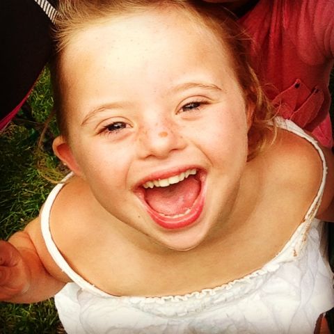 Ellie Bowerman laughs during a play date with her friends. The 4-year-old has Down syndrome, but "she's more alike than different," writes her father, Bret Bowerman.