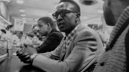 Franklin McCain sits at a lunch counter at a  and three fellow African-American college students made history just by sitting down at a Woolworth's lunch counter in Greensboro, North Carolina, and waiting.