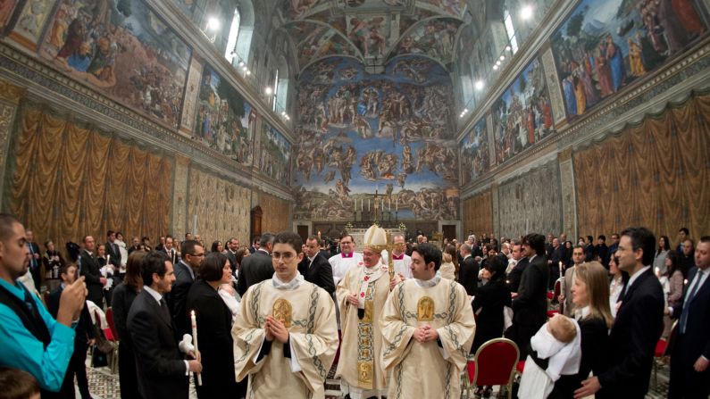 Pope Francis leaves the Sistine Chapel after the ceremony.