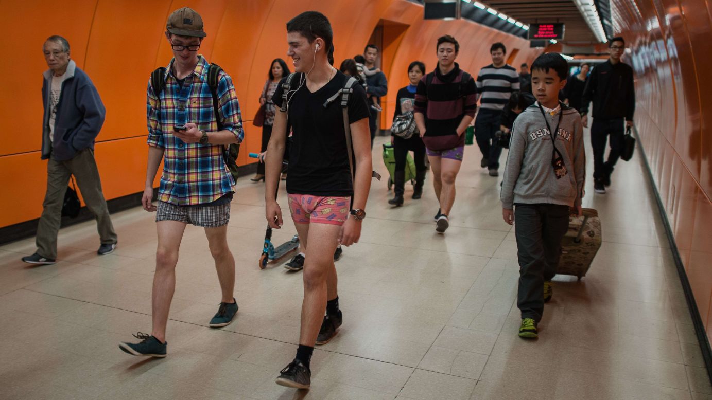 People walk around a Hong Kong train station in their underwear.