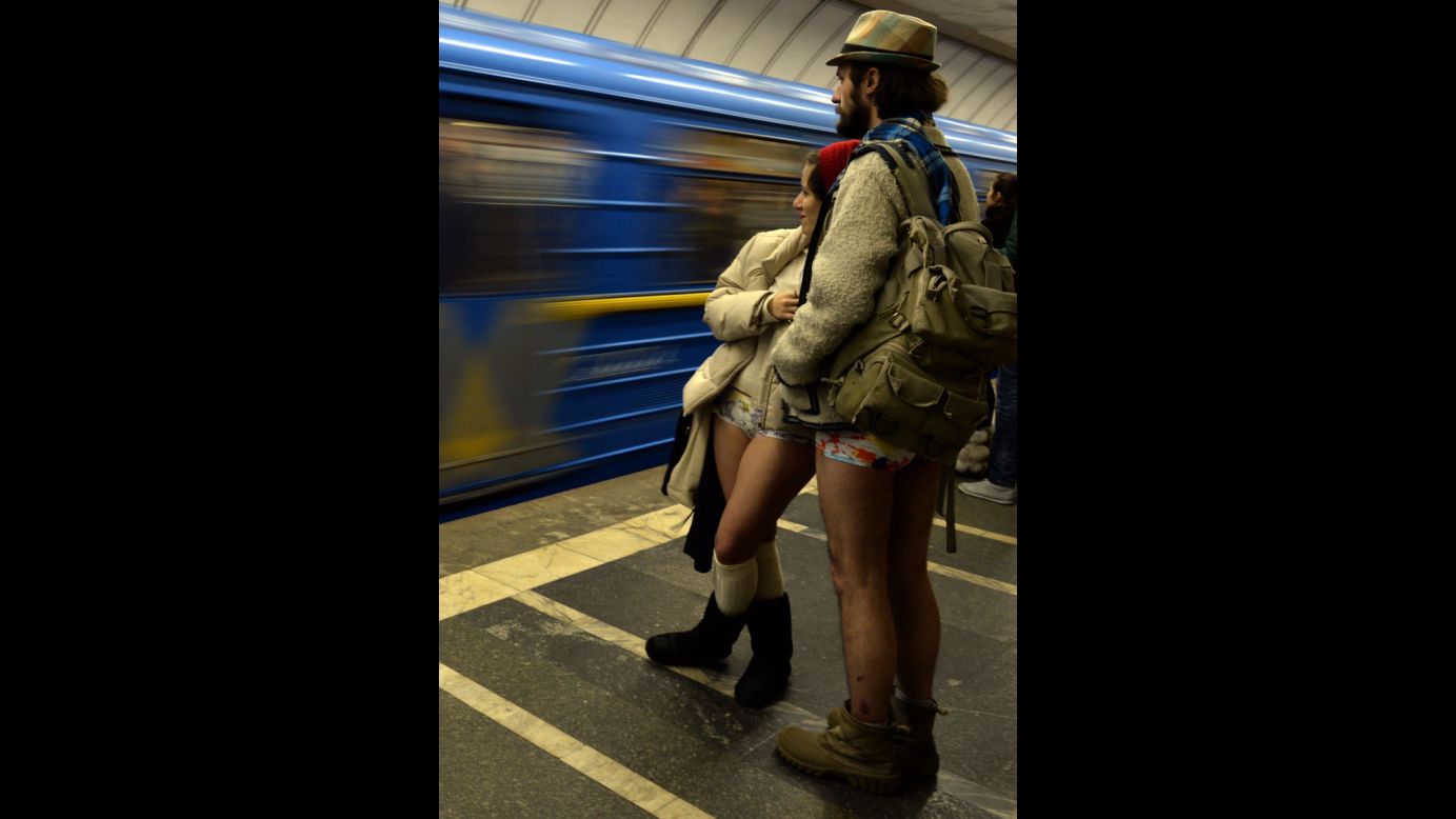 A couple in their underwear wait for a train at a Kiev, Ukraine, subway station.