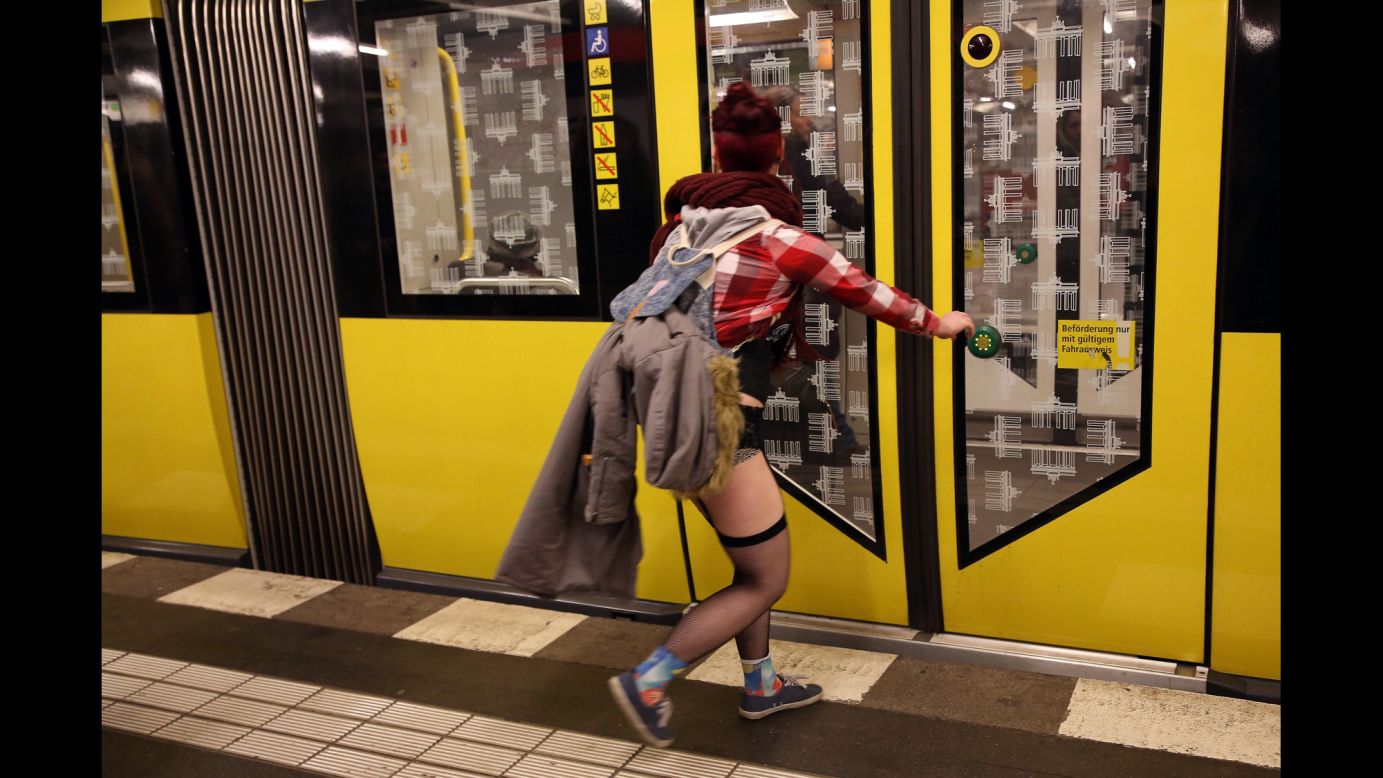 A woman in her underwear rushes to catch a train in Berlin.