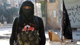 A member of jihadist group Al-Nusra Front stands in a street of the northern Syrian city of Aleppo on January 11, 2014.