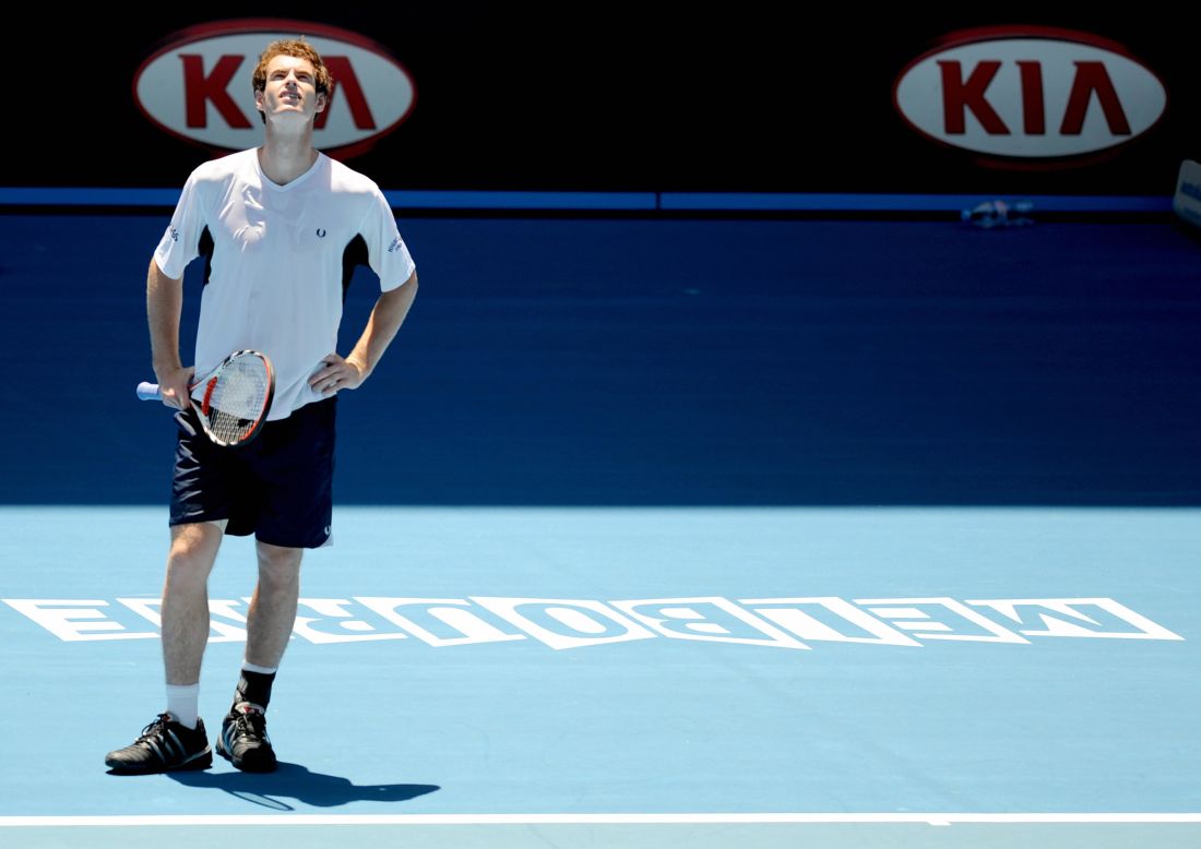 Andy Murray tries to acclimatize himself to the searing conditions during the hottest championship on record in 2009 at Melbourne Park.