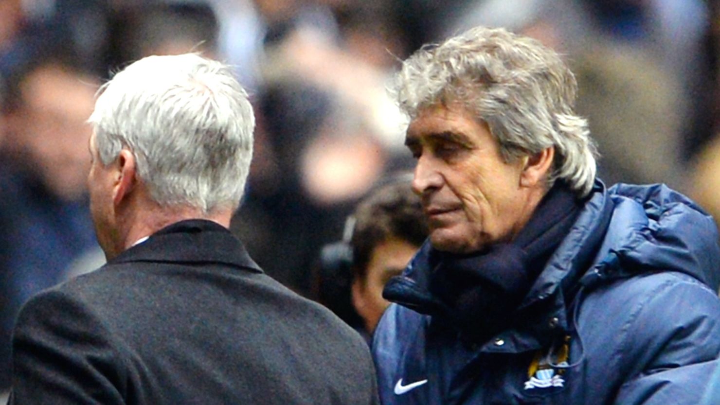 Manuel Pellegrini (R) with Alan Pardew following Manchester City's controversial win over Newcastle.  