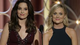 Hosts Tina Fey and Amy Poehler speak onstage during the 71st Annual Golden Globe Awards in Beverly Hills, California, on Sunday, January 12.