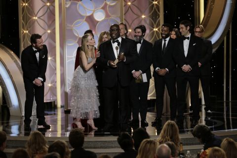 Director Steve McQueen and the cast of the film "12 Years a Slave" accept the award for best drama.