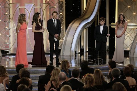 Kyra Sedgwick, left, and Kevin Bacon, third from left, are interrupted while introducing their daughter Sosie Bacon, right, as this year's Miss Golden Globe. Fey, second from left, jokes that her adult son Randy, played by Poehler, second from right, is Mr. Golden Globe "in the name of gender equality."