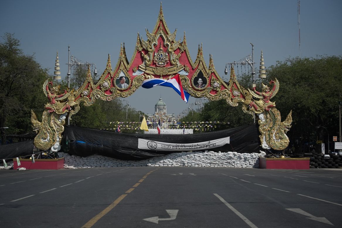 Sandbags block a street outside the Government House in Bangkok on January 12, 2014.