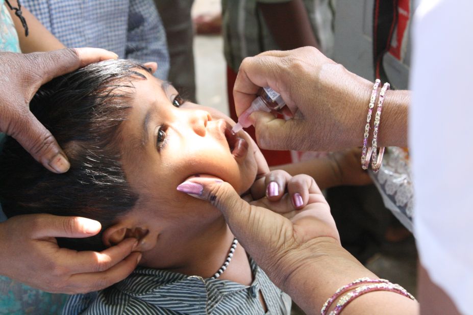 The disabling disease can be prevented with a vaccine. A boy receives an oral vaccine in 2013. 