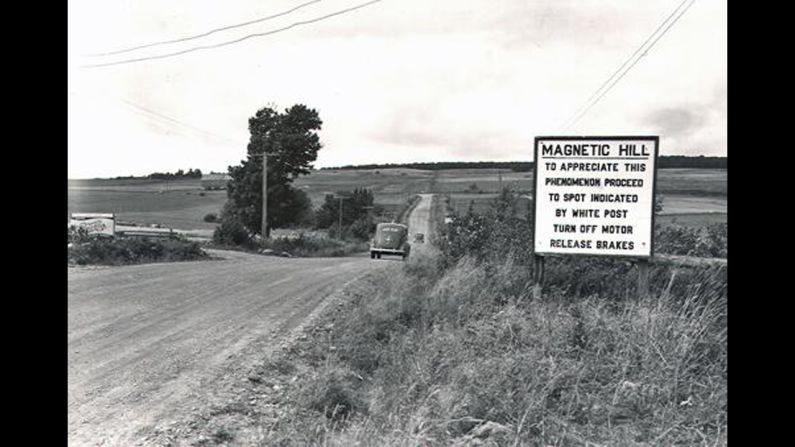 Though ultimately an optical illusion and not a magnetic force, the sensation of rolling backward uphill without power on Magnetic Hill has drawn carloads of travelers to test this curiosity since it was discovered in the 1930s. This circa 1940 photo gives drivers instructions.