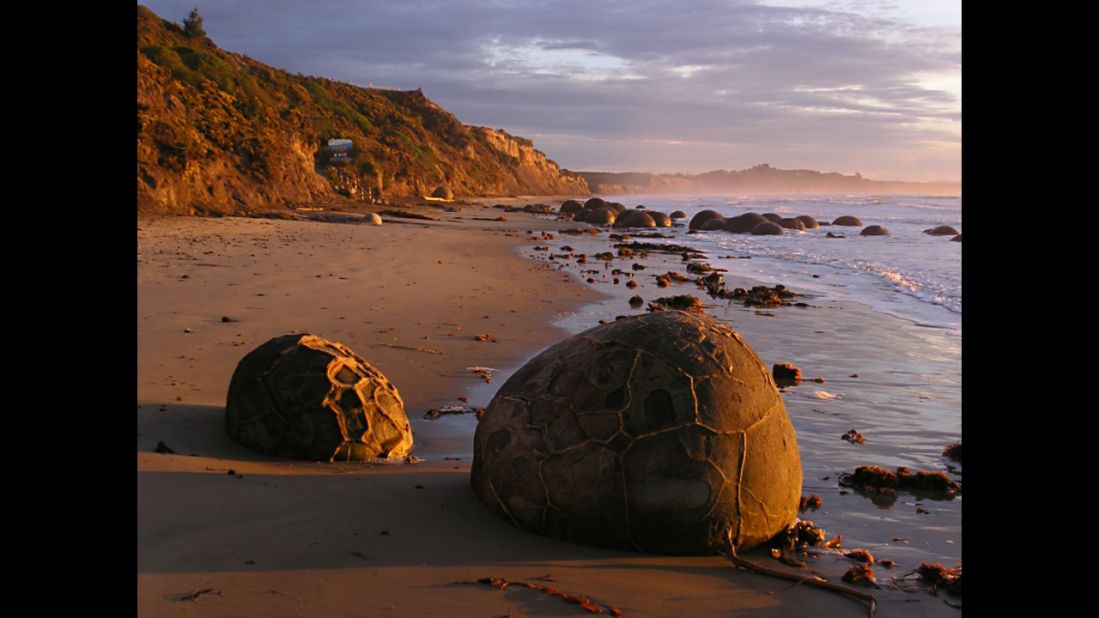 Large spherical boulders that formed millions of years ago on the ancient sea floor now dot Koekohe Beach on the east coast of New Zealand's South Island. They're what geologists call septarian concretions.