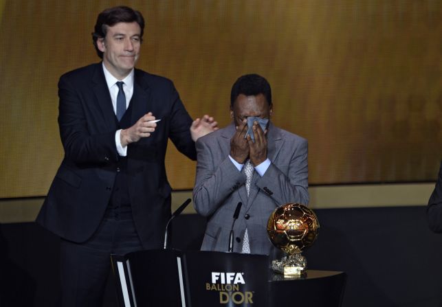 Brazilian legend Pele cries as he is handed an honorary FIFA Ballon d'Or, with the three-time World Cup winner having been ineligible to win the award during his playing days because he did not play in Europe.