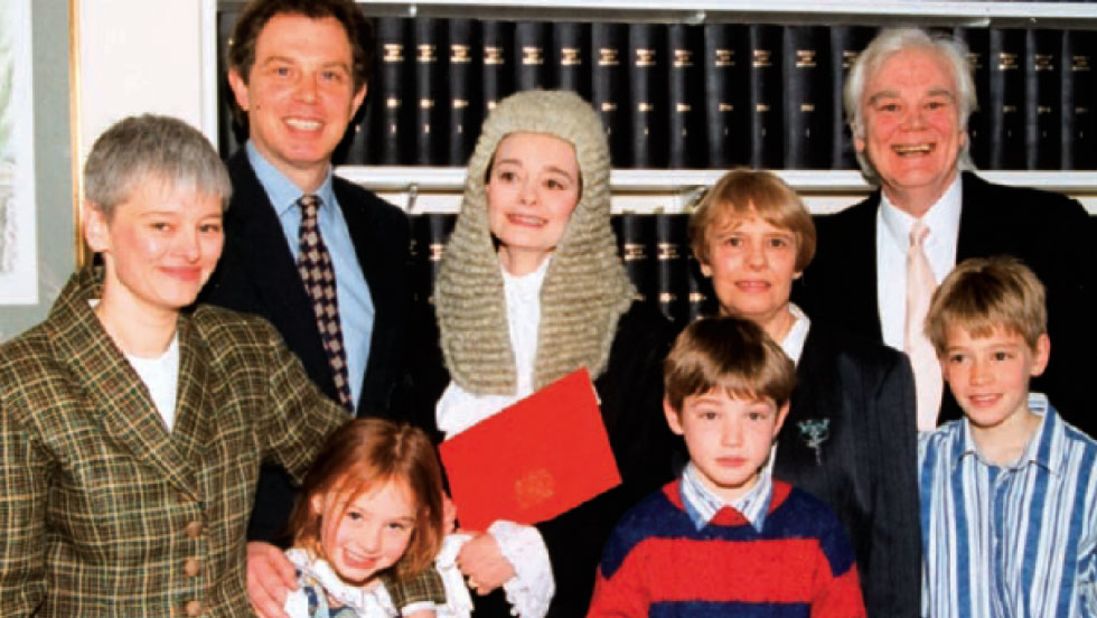 As her spouse rose in the political ranks, Blair -- who professionally goes by her maiden name of "Cherie Booth" -- carved out a successful career first as an attorney, then in 1995 (pictured here with her family) she received the senior advocate status of Queen's Counsel. 