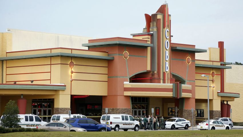 Police tape surrounds the Cobb Grove 16 movie theater in Wesley Chapel, Florida, on January 13. A moviegoer shot and killed one person and wounded another on Monday when an argument over text messaging in the Florida theater showing the hit new war film "Lone Survivor" erupted in gunfire, authorities said.