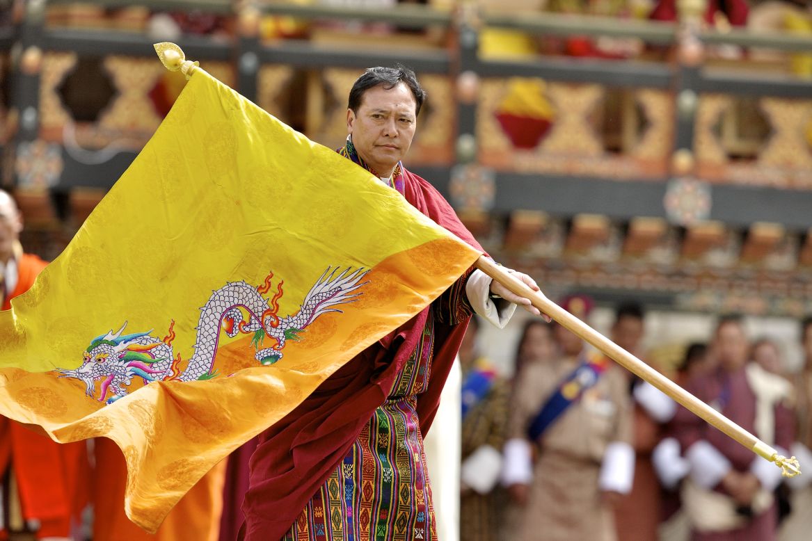 The beast on Bhutan's flag is Druk, a thunder dragon of Bhutanese Buddhist mythology. The dragon is said to symbolize the origins of religious teachings on which Bhutan was founded. 