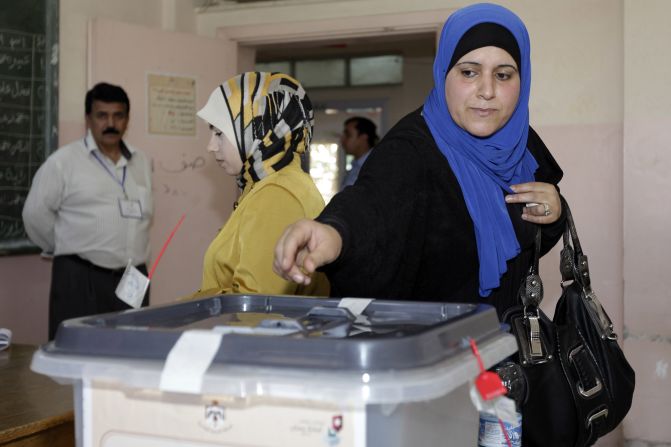 A Jordanian woman casts her ballot for municipal elections at a polling station in Amman on August 27, 2013. The Muslim Brotherhood, the main opposition party, is boycotting the polls, charging that, despite repeated promises since the Arab Spring of 2011, there is no real readiness for change.