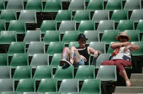 While supporters in the Rod Laver Arena could at least take cover under its roof, fans on the outside courts were exposed to the elements.