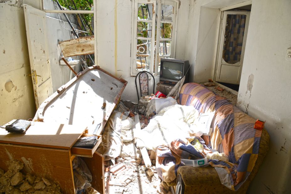 The eerie quality of the photos is striking, with mundane household items strewn amid the rubble of countless battles.