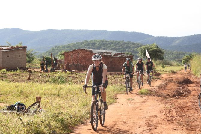 Tour d'Afrique's highlights include crossing the Equator in Kenya, passing Mount Kilimanjaro and the Serengeti in Tanzania, as well as Lake Malawi, Victoria Falls, and Namib desert. (Pictured, 2013 Tour)