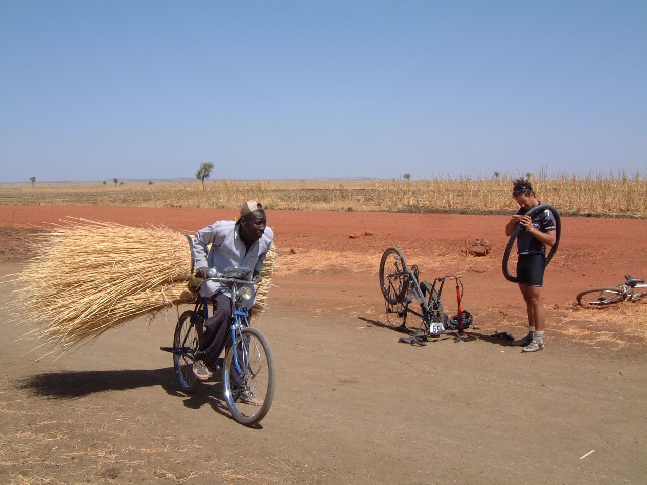 This local cyclist performs an endurance feat of his own, while a competitor deals with a puncture. (Pictured, 2013 Tour)