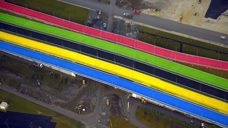 A picture taken from a helicopter in December shows roads under construction at the Olympic Park in the Russian Black Sea resort of Sochi. Another road, which links the Sochi Olympic event stadiums with the mountains cost an estimated $8.2 billion to build.