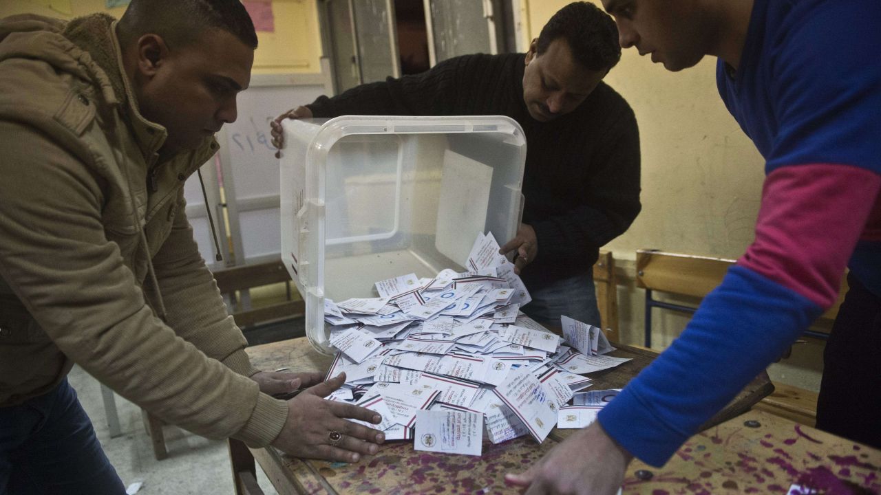 Officials in Cairo earlier this week count ballots from the constitutional referendum.