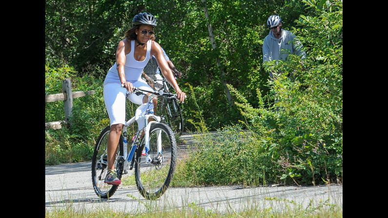 The first lady rides a bike while vacationing in 2013 in Martha's Vineyard, an island off the coast of Massachusetts.