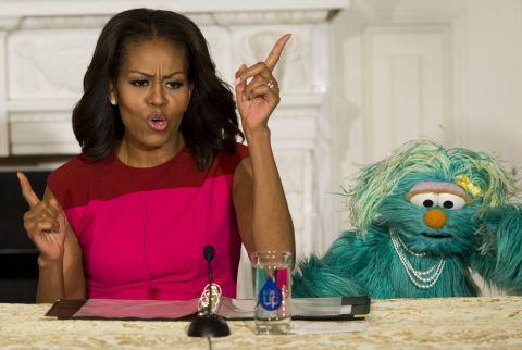 Obama dances alongside "Sesame Street" character Rosita at the White House in October 2013 as part of the first lady's "Let's Move" initiative.