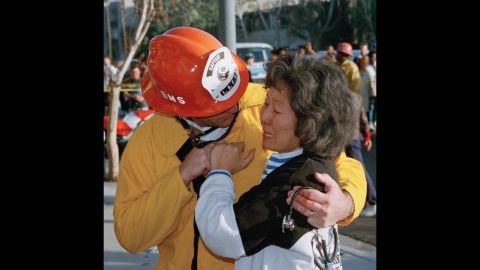 Hyun Sook Lee cries after being told by Dave Thompson of the Los Angeles Fire Department that her 14-year-old son had been killed in the collapse of her apartment. Her husband was also found dead.