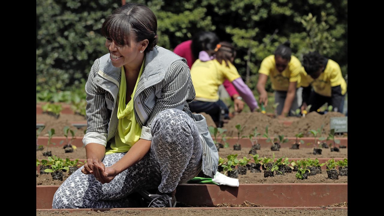 Obama plants the White House Kitchen Garden on the South Lawn of the White House in April 2013. To help her, she invited students from schools "that have made exceptional improvements to school lunches." It was part of the first lady's "Let's Move" campaign, which she launched in 2010 to reduce childhood obesity. 