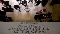 A logo of the World Economic Forum Annual Meeting 2013 is pictured on January 26, 2013 as people have lunch at the Swiss resort of Davos. AFP PHOTO / JOHANNES EISELE (Photo credit should read JOHANNES EISELE/AFP/Getty Images)