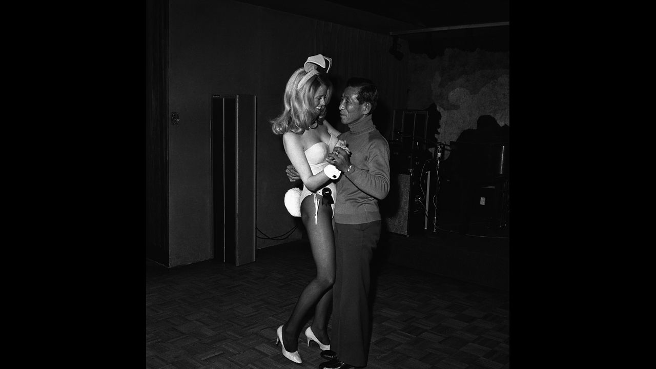 Onoda dances with a Playboy waitress at the Playboy Club in Chicago in 1975 while on a tour of the United States.