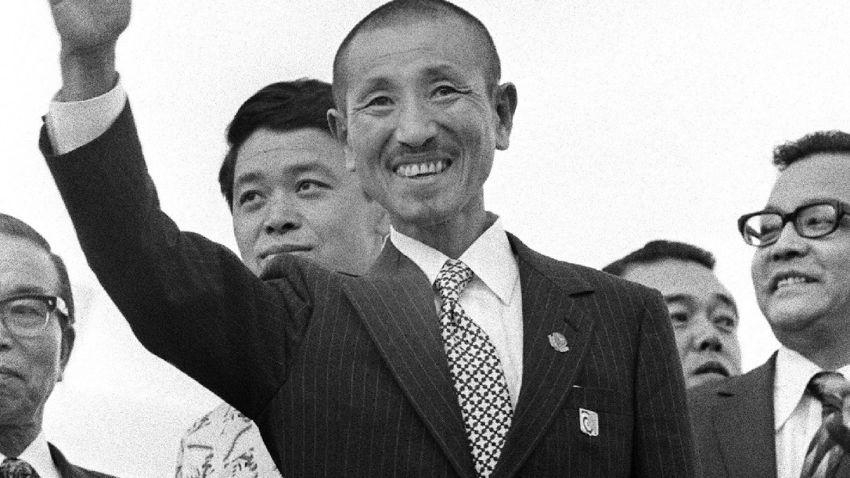 Hiroo Onoda (center) at Tokyo international airport on March 12, 1974 after returning home from the Philippine jungles.