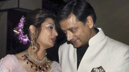 FILE -- In this Sept. 4, 2010 file photo, former Indian Junior Foreign Minister Shashi Tharoor listens to his wife Sunanda Pushkar at their wedding reception in New Delhi, India. Police say on Friday, Jan. 17, 2014, they have found the body of the wife of an Indian federal minister in a New Delhi hotel room after a controversy over her husband's alleged affair with a Pakistani journalist. Officer Rakesh Kumar says police are investigating the cause of Sunanda Pushkar's death. (AP Photo/File)