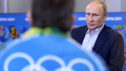 Russian President Vladimir Putin meets upcoming Olympic games' volunteers in Sochi on January 17, 2014.