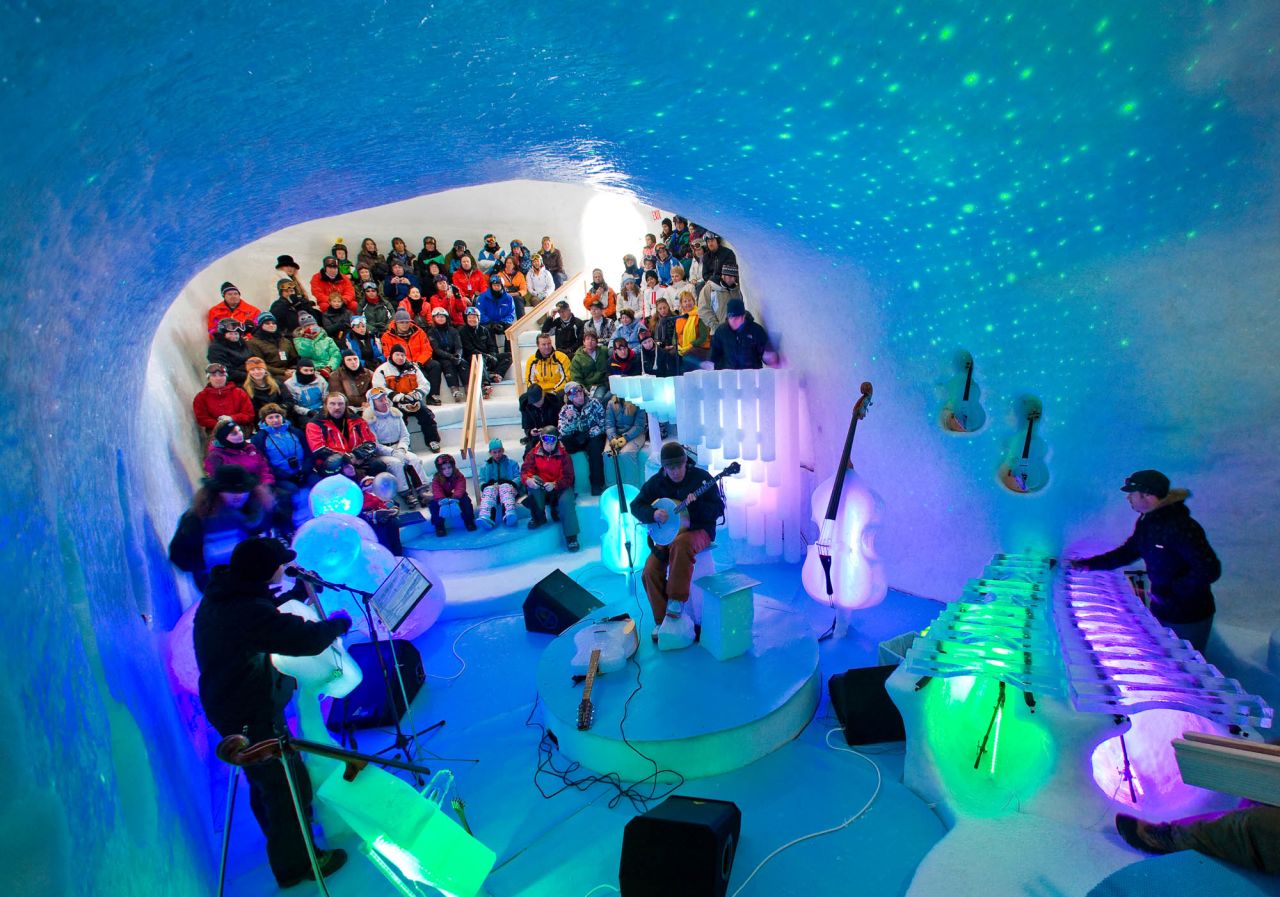 Up to 170 audience members chill with the band in an igloo auditorium. The organizers' clothing advice? Layer.