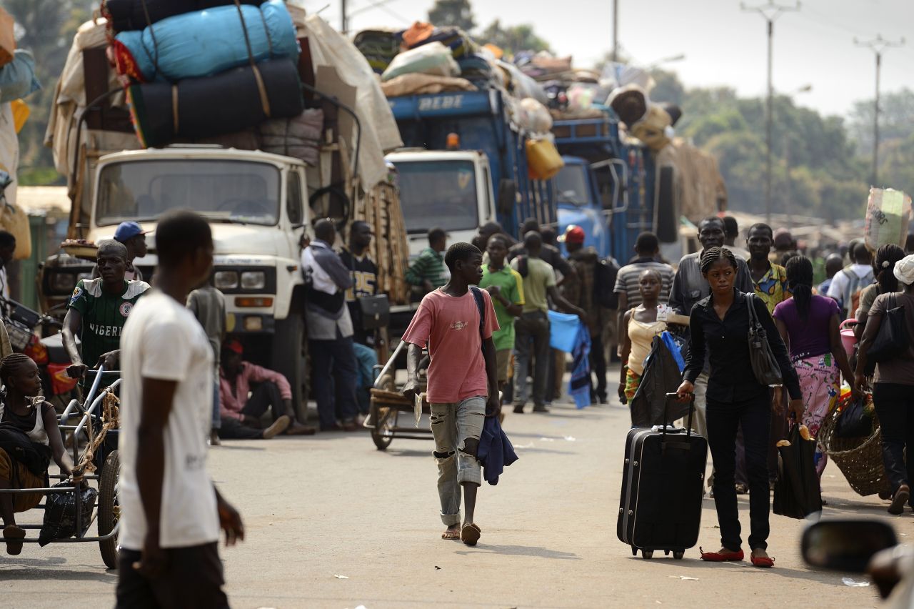 Muslim civilians prepare to board trucks in Bangui to flee the capital on Saturday, January 18.